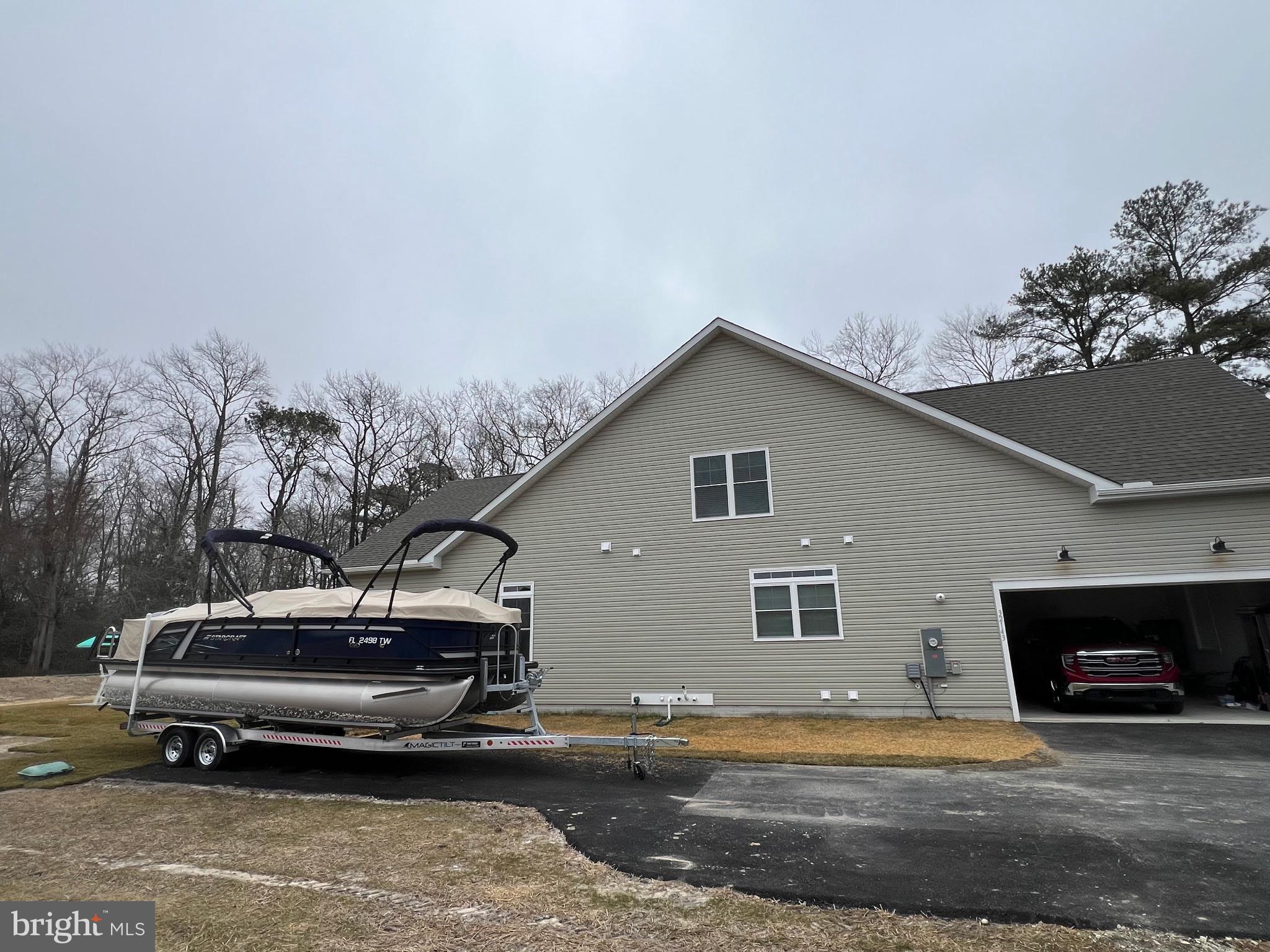 32143 Lynch Road Selbyville, DE 19975 - Photo 56 of 56 a car parked in front of a house
