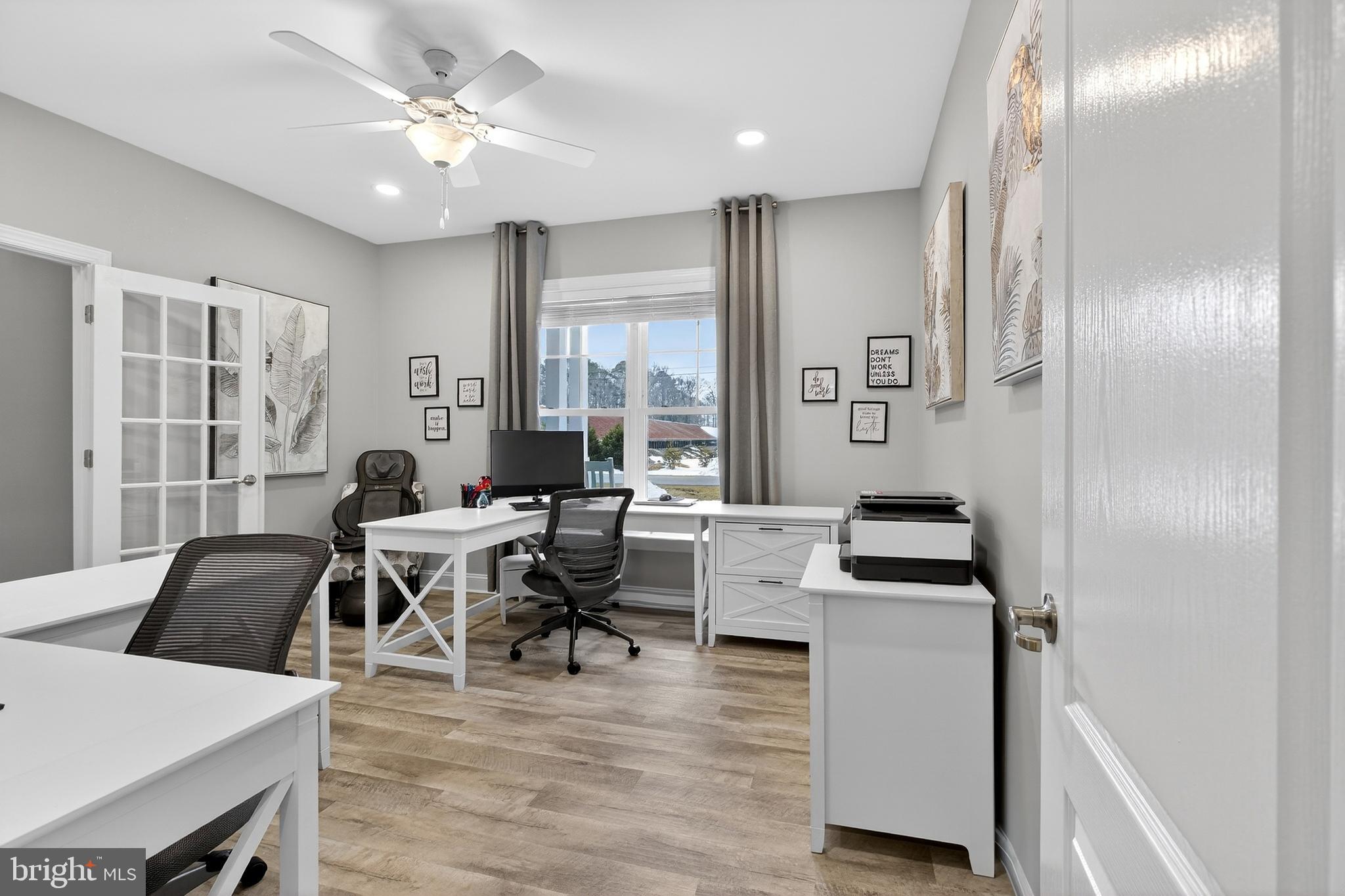 32143 Lynch Road Selbyville, DE 19975 - Photo 8 of 56 a living room with furniture and wooden floor