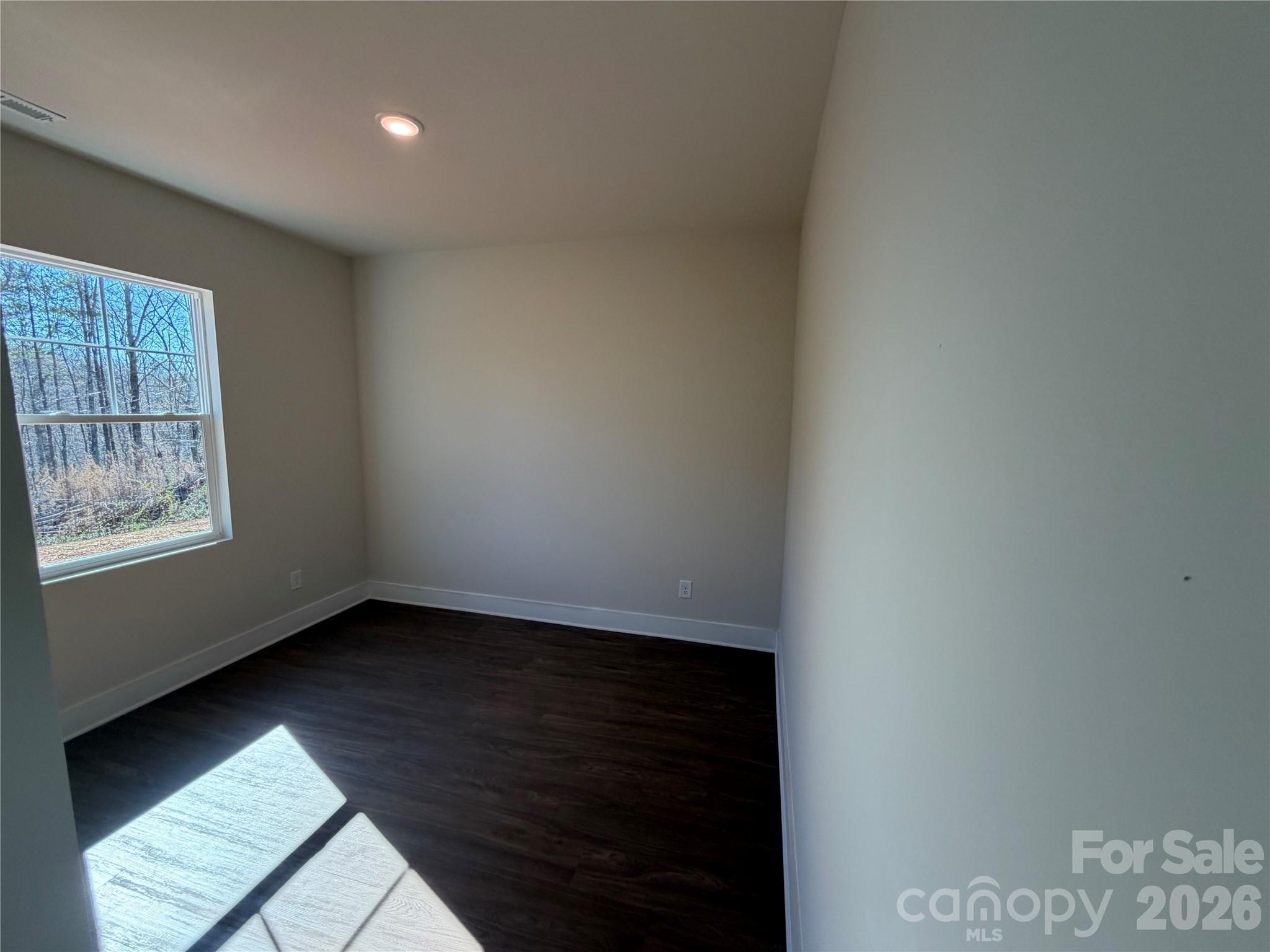 916 Blake Road Albemarle, NC 28001 - Photo 11 of 22 a view of an empty room and window