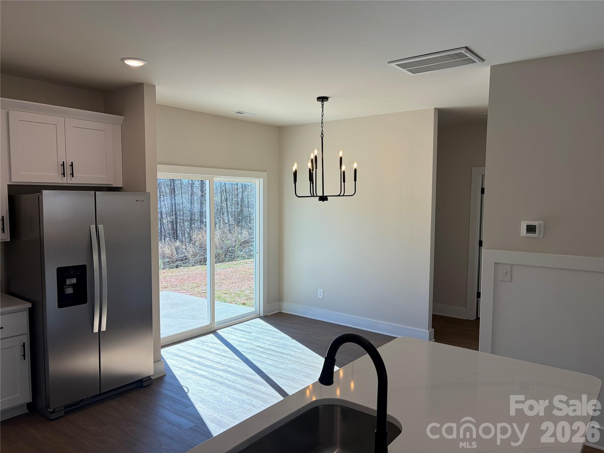 916 Blake Road Albemarle, NC 28001 - Photo 6 of 22 a view of a kitchen with a refrigerator and window