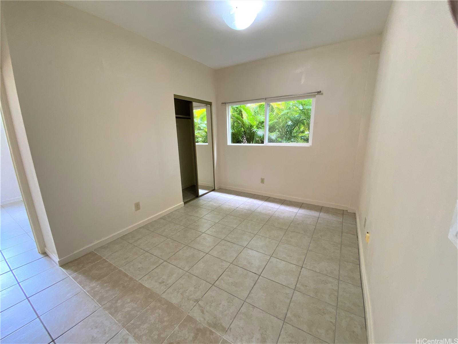 3339 Manoa Road, Unit 5 Honolulu, HI 96822 - Photo 3 of 13 an empty room with windows