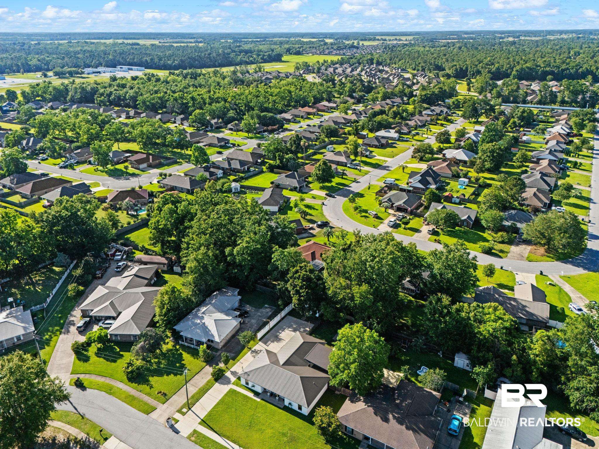 524 Ariel Avenue Foley, AL 36535 - Photo 33 of 37 Aerial depiction of a residential neighborhood with numerous single-story homes