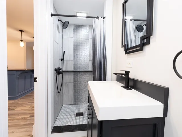 a bathroom with a sink and a mirror