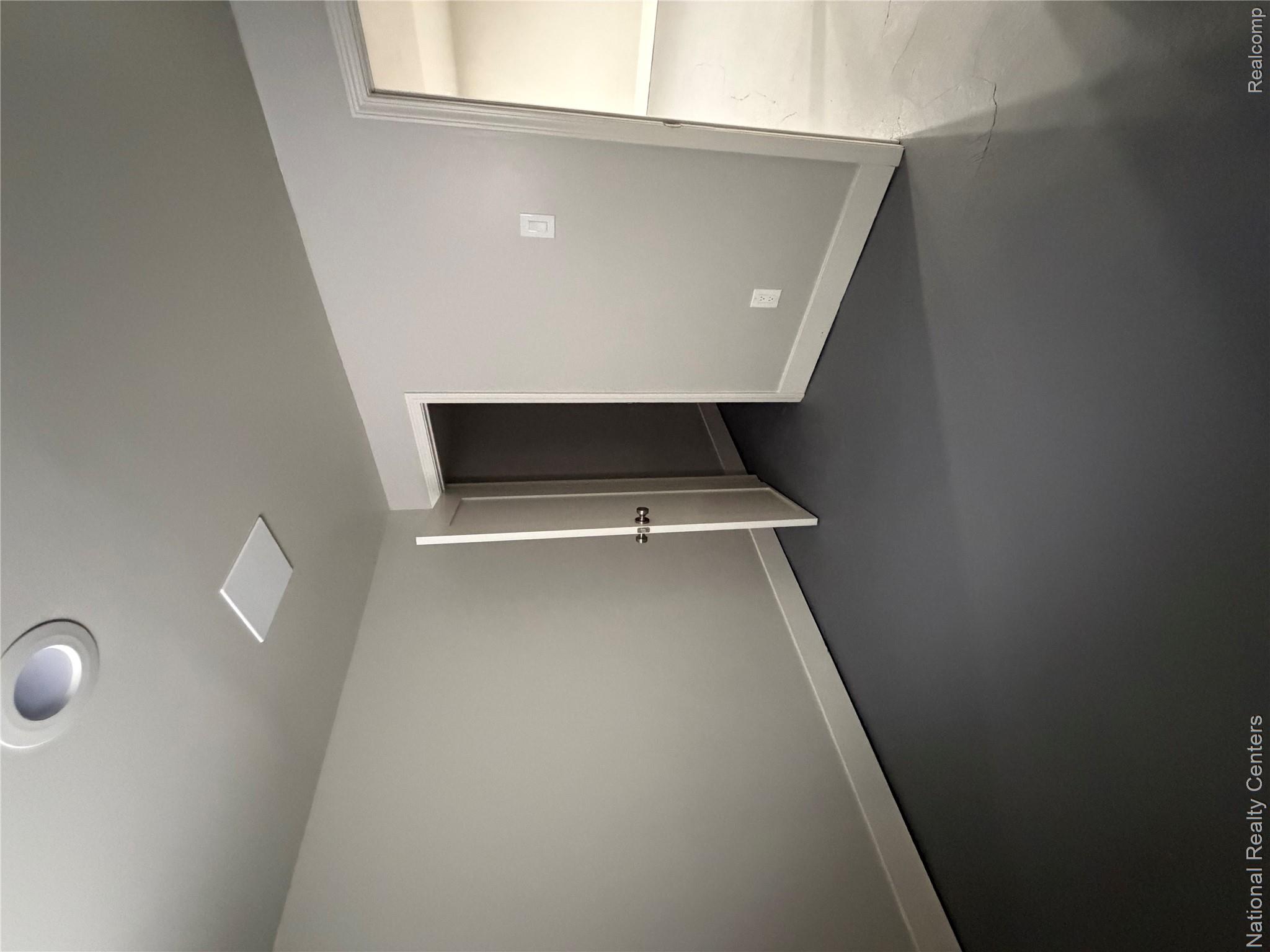 16522 Inverness Street Detroit, MI 48221 - Photo 41 of 62 Spare room featuring concrete flooring and baseboards