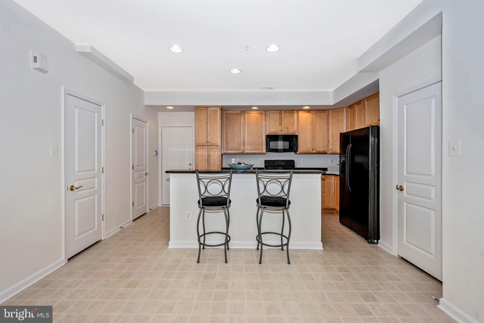 1790 Poolside Way, Unit 22A Frederick, MD 21701 - Photo 18 of 64 kitchen with an island and breakfast bar area