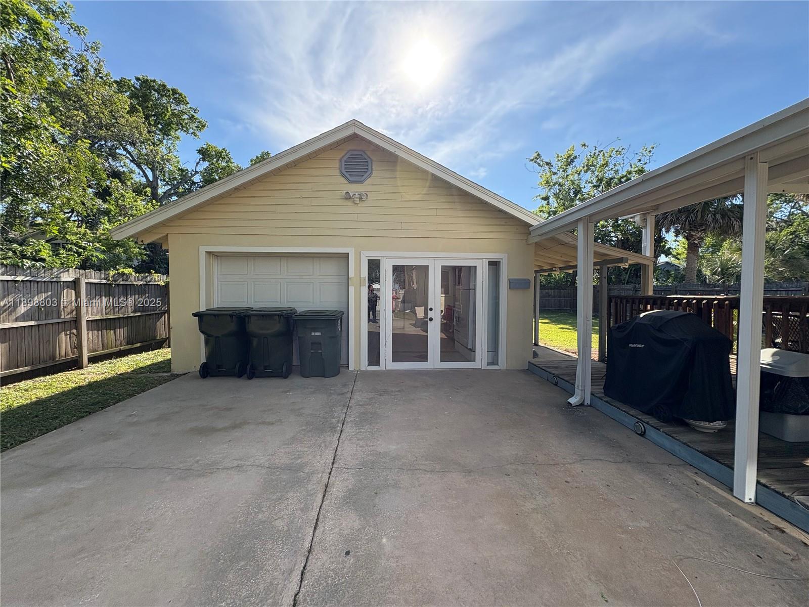 830 South Beach Street, Unit 2 Daytona Beach, FL 32114 - Photo 1 of 11 a front view of a house with a garden and yard
