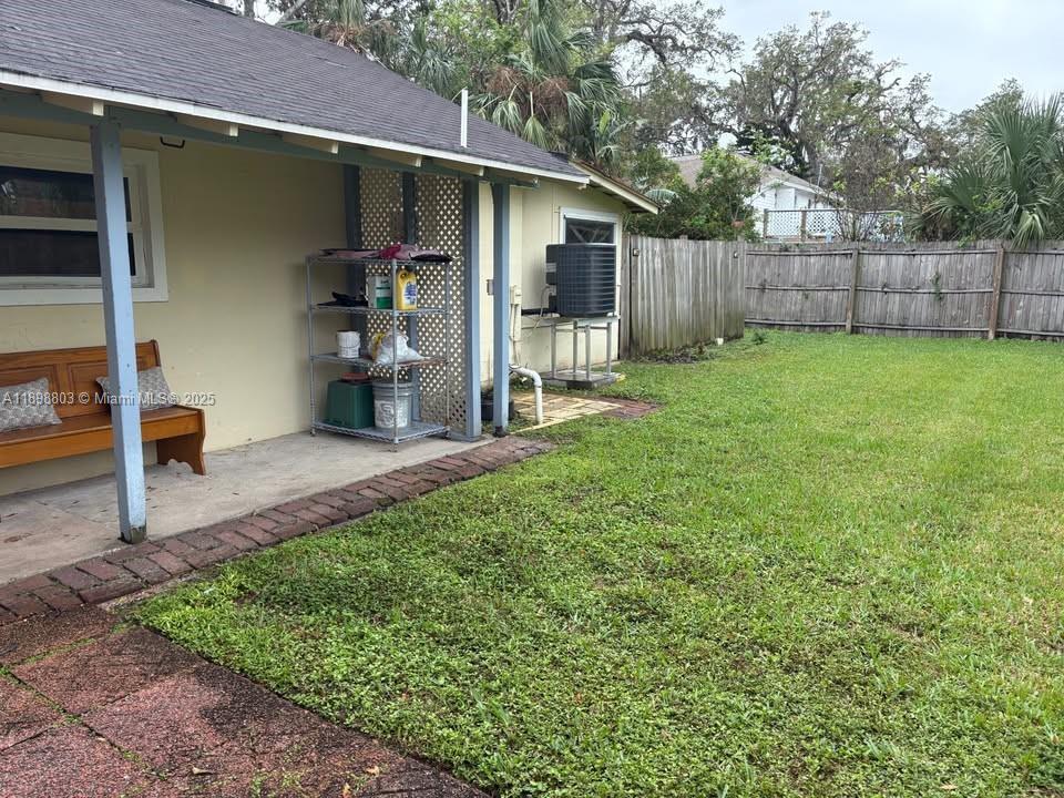 830 South Beach Street, Unit 2 Daytona Beach, FL 32114 - Photo 3 of 11 a view of a back yard of the house