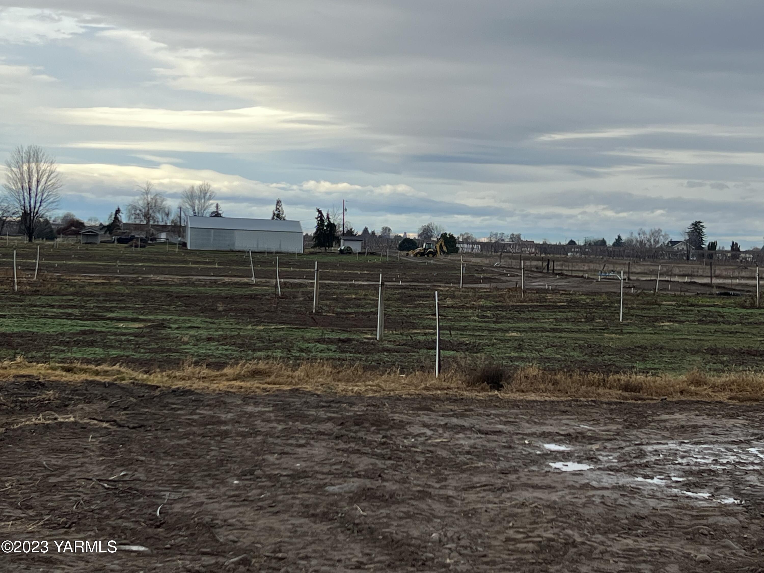 0 Hicks Road Grandview, WA 98930 - Photo 15 of 28 a view of a field with wooden fence