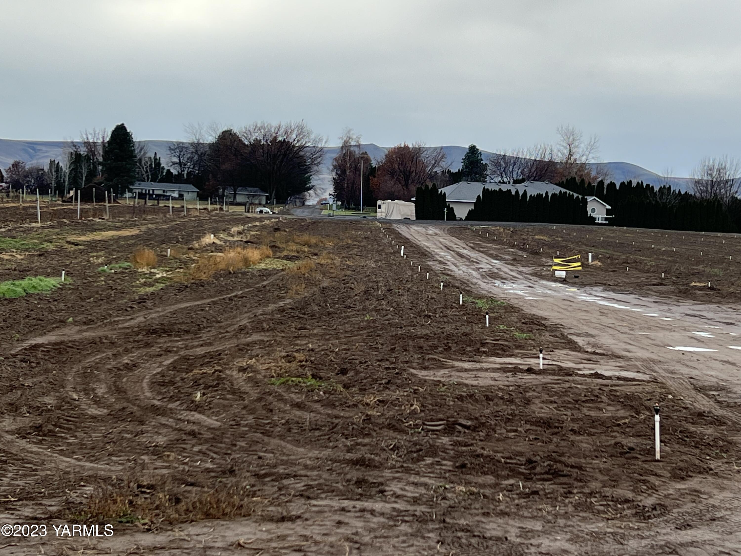 0 Hicks Road Grandview, WA 98930 - Photo 27 of 28 a view of a road with a building in the background