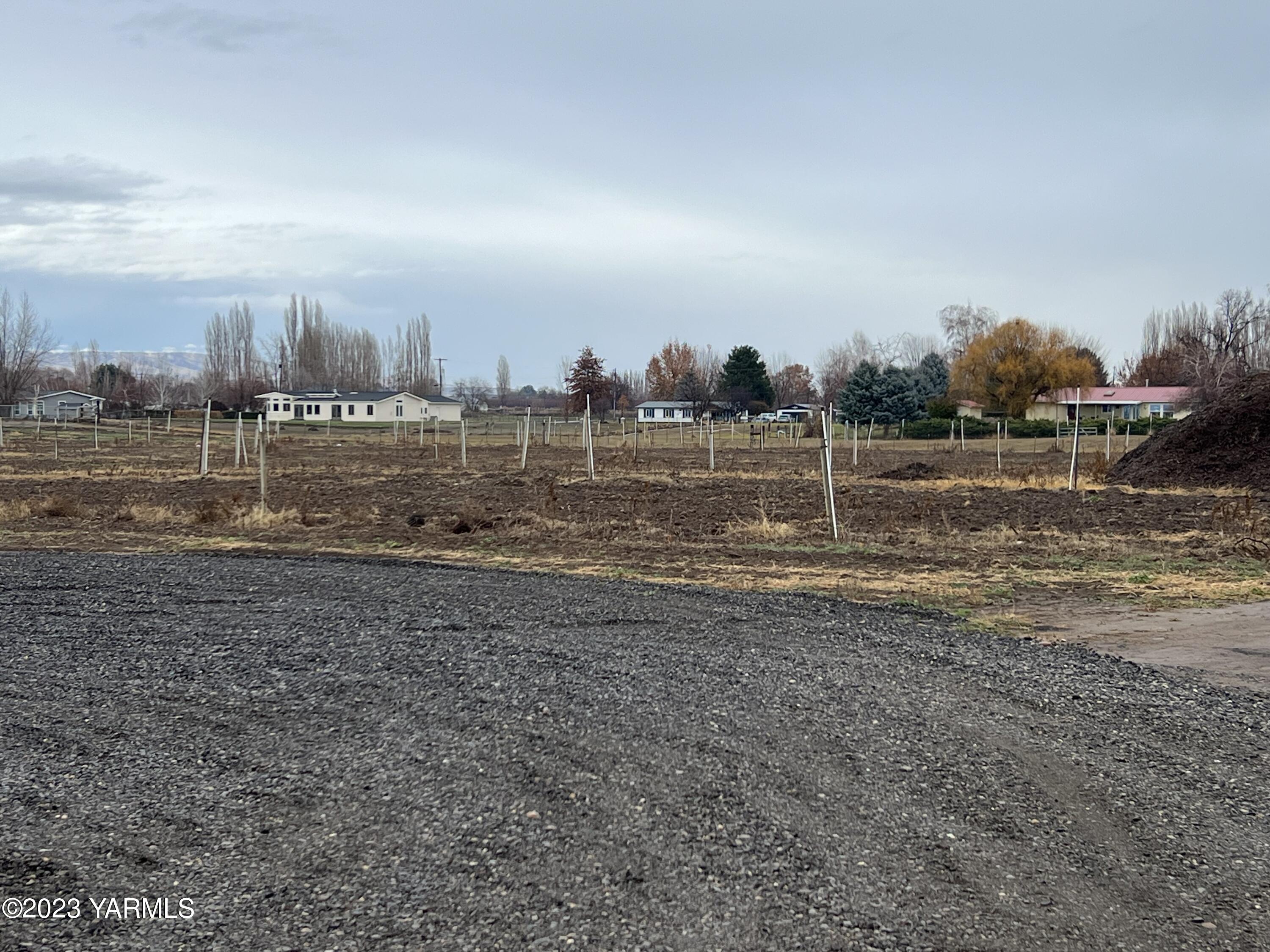 0 Hicks Road Grandview, WA 98930 - Photo 5 of 28 a view of a field with wooden fence