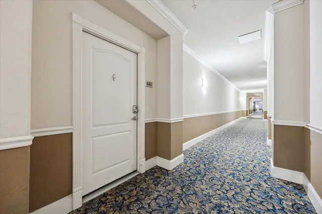a view of hallway with wooden floor
