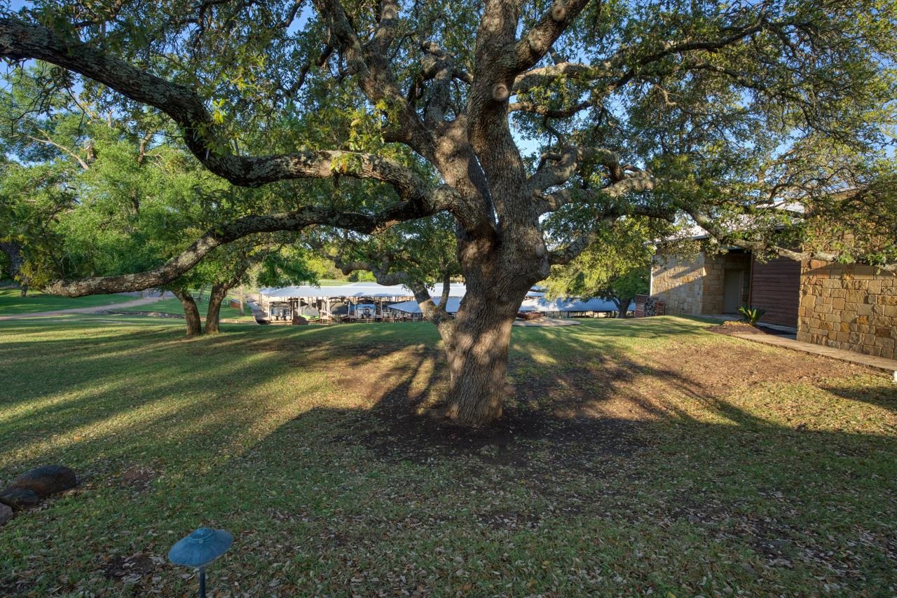 Lot 28 The Trails Parkway Horseshoe Bay, TX 78657 - Photo 12 of 30 a view of a tree in front of a house