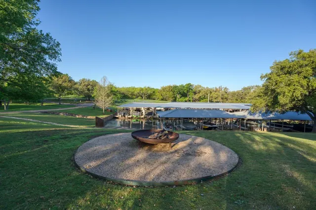a view of a swimming pool and lounge chairs in the patio