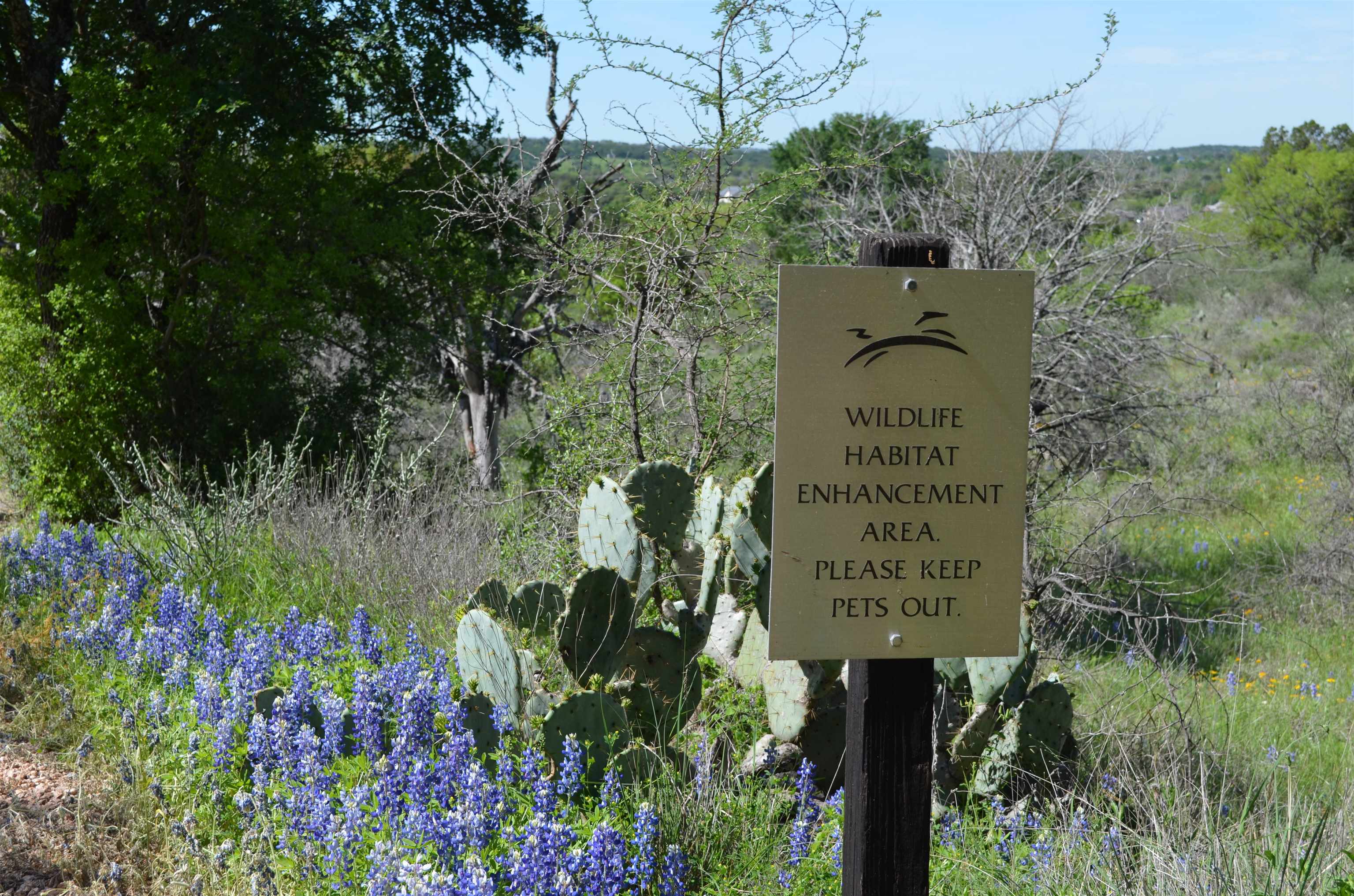 Lot 28 The Trails Parkway Horseshoe Bay, TX 78657 - Photo 28 of 30 a sign on the side of the wall