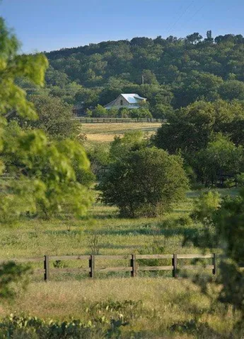 a view of a lake with a yard