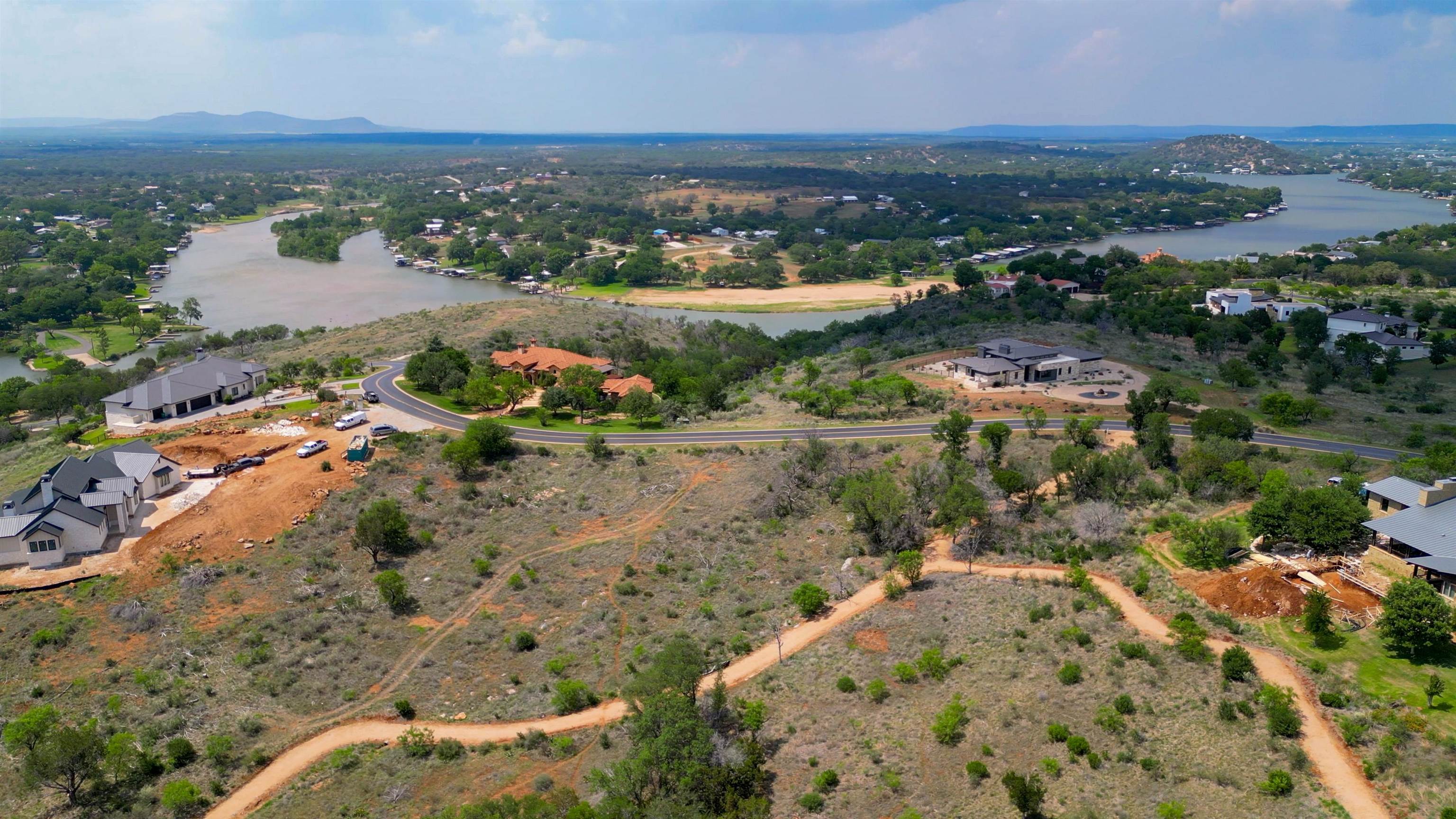 Lot 28 The Trails Parkway Horseshoe Bay, TX 78657 - Photo 3 of 30 an aerial view of residential houses with outdoor space and river