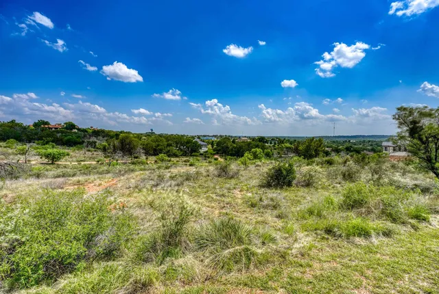 a view of a golf course with a house