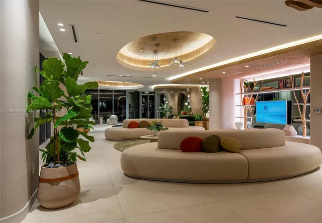 a view of a hallway with seating space