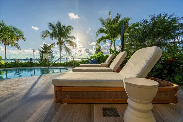 a view of a swimming pool with a patio