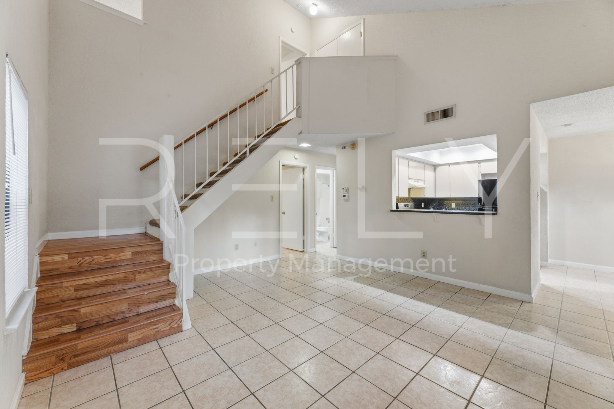 1005 Milford Way, Unit A Austin, TX 78745 - Photo 5 of 30 a view of entryway and hall with a window