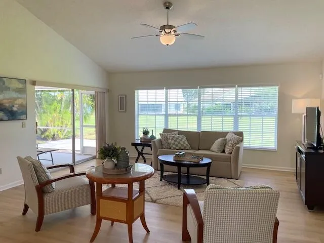a living room with furniture fireplace and a flat screen tv