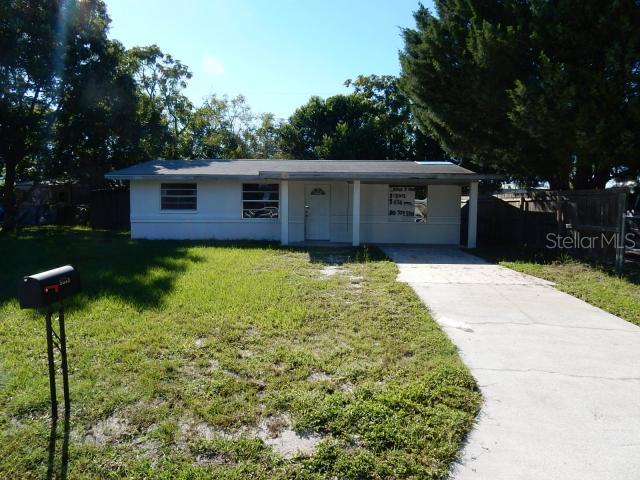 8833 Mike Street Port Richey, FL 34668 - Photo 1 of 1 a front view of a house with garden