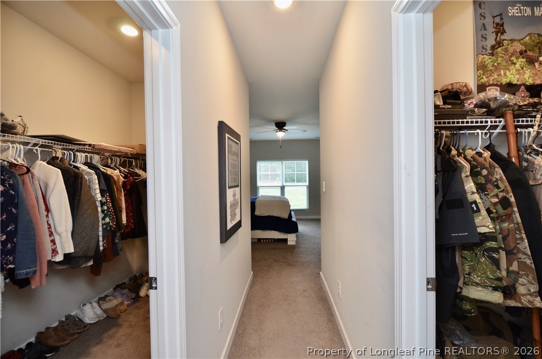 1865 John B Carter Road Fayetteville, NC 28312 - Photo 22 of 49 a view of walk in closet with clothes and shoes