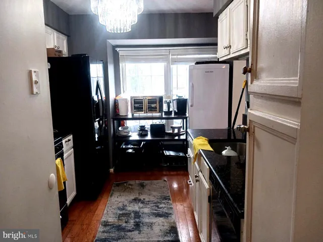 a bathroom with a granite countertop sink and vanity