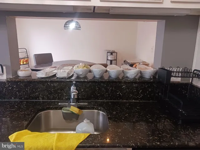 a kitchen with stainless steel appliances a refrigerator a stove a microwave a sink and dishwasher