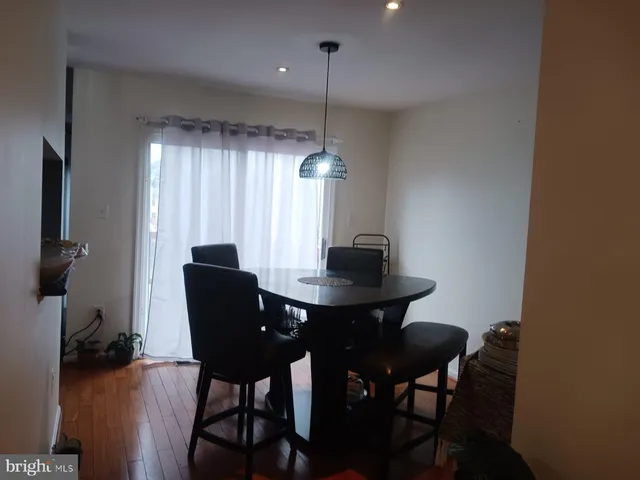 a kitchen with granite countertop a sink a stove and cabinets