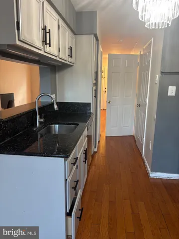 a kitchen with a stove and cabinets