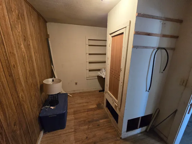 a view of workspace with wooden floor and gym equipment