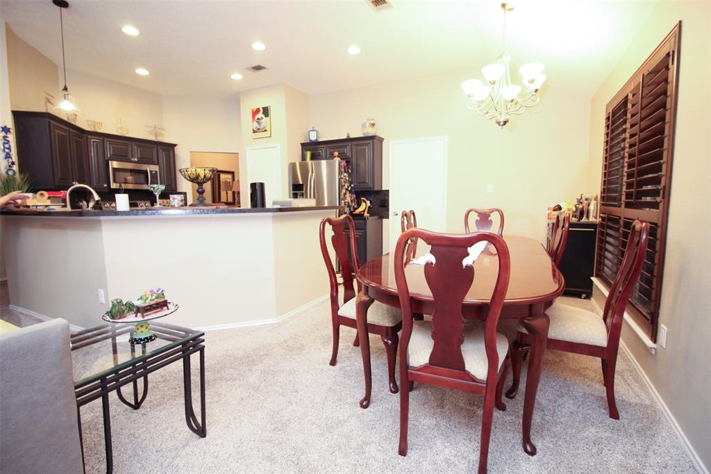 1606 Tyler Terrace Mansfield, TX 76063 - Photo 11 of 36 a view of a dining room with furniture