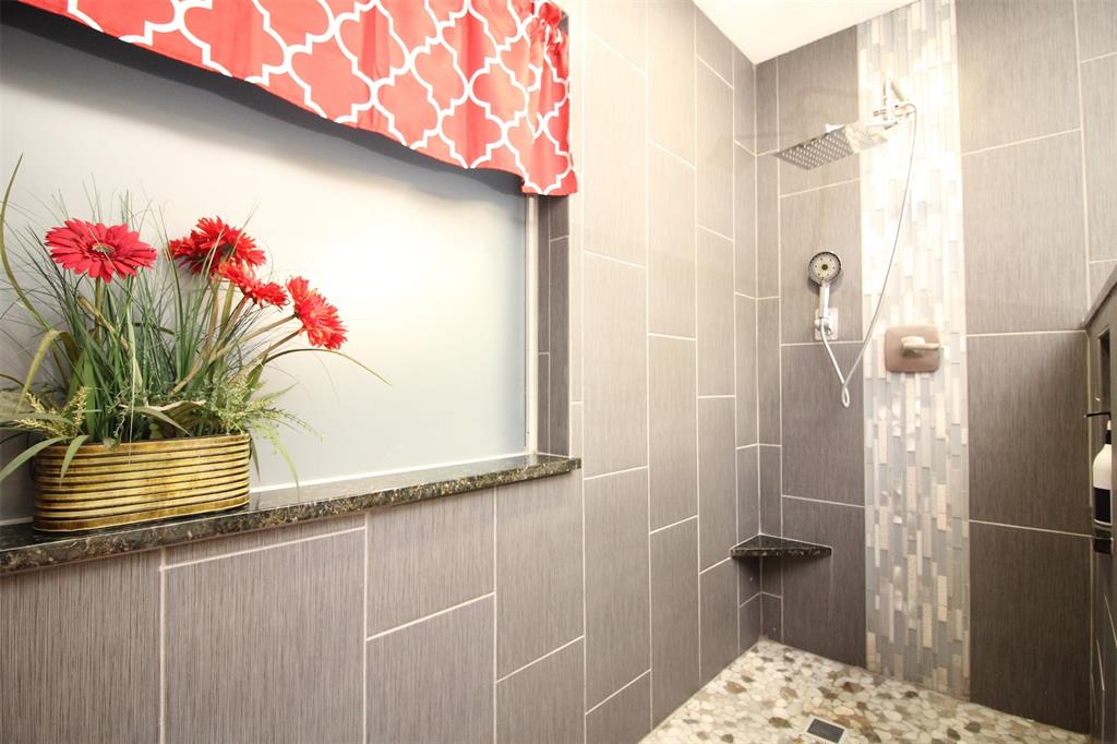 1606 Tyler Terrace Mansfield, TX 76063 - Photo 18 of 36 a bathroom with a shower and a sink