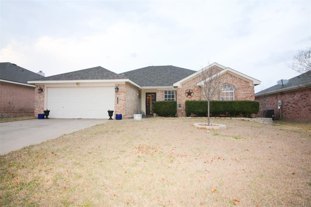 1606 Tyler Terrace Mansfield, TX 76063 - Photo 2 of 36 a front view of a house with a yard and garage