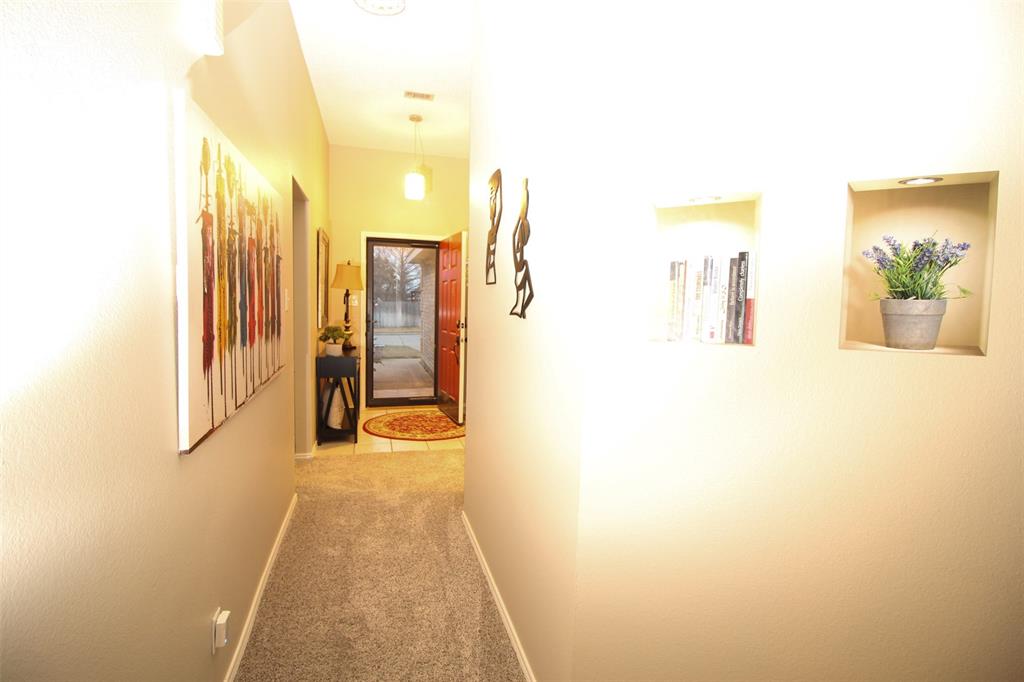 1606 Tyler Terrace Mansfield, TX 76063 - Photo 28 of 36 a view of a hallway with wooden floor
