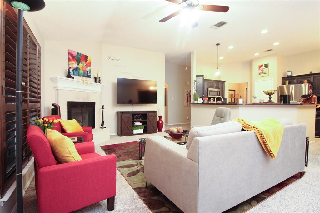 1606 Tyler Terrace Mansfield, TX 76063 - Photo 3 of 36 a living room with furniture and a fireplace