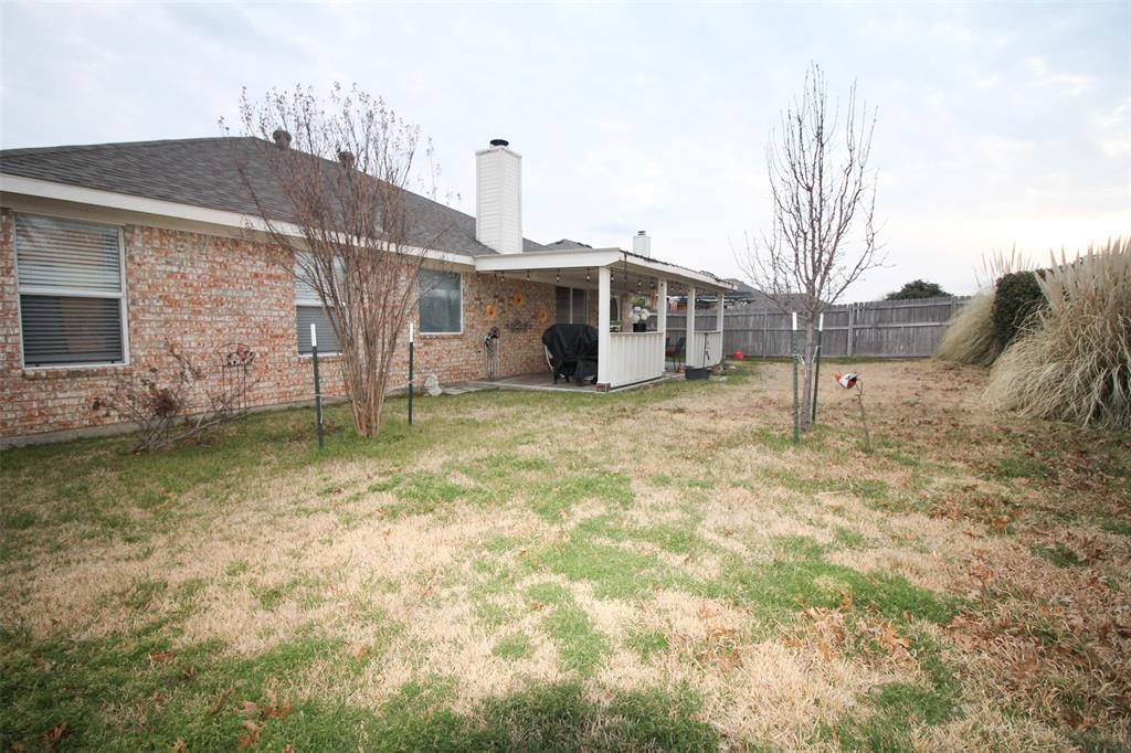1606 Tyler Terrace Mansfield, TX 76063 - Photo 31 of 36 a view of a house with a yard