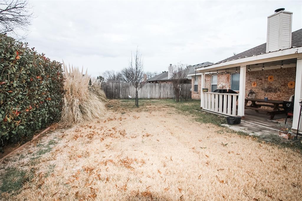 1606 Tyler Terrace Mansfield, TX 76063 - Photo 33 of 36 a view of backyard of a house