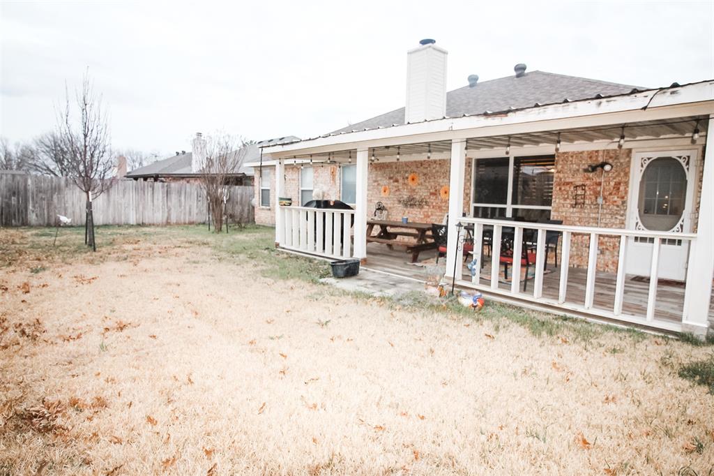 1606 Tyler Terrace Mansfield, TX 76063 - Photo 34 of 36 a view of a house with wooden fence