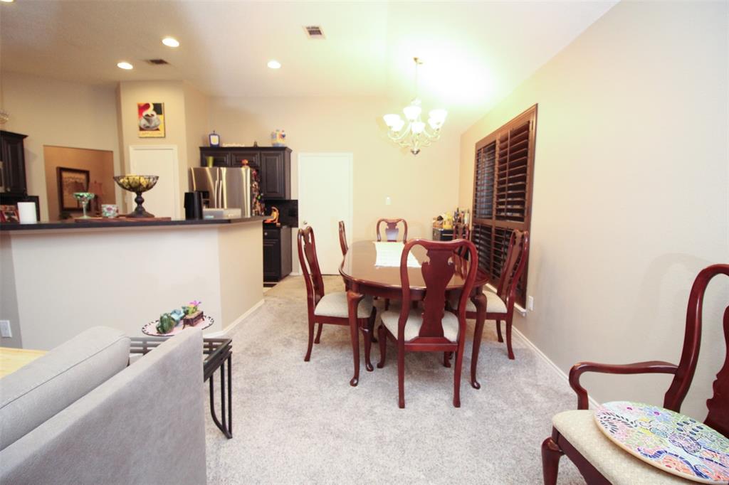 1606 Tyler Terrace Mansfield, TX 76063 - Photo 10 of 36 a dining room with furniture and a couch
