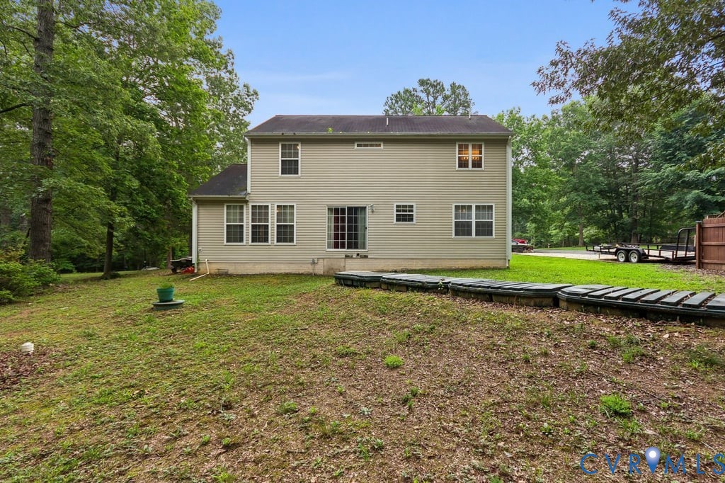 83 Albertson Court Ruther Glen, VA 22546 - Photo 5 of 25 Rear exterior showcasing a neutral-toned siding fa