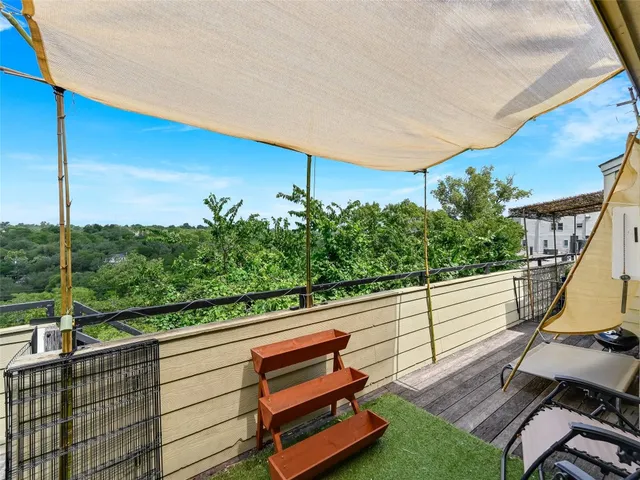 a view of a two chairs in the roof deck