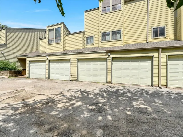 a front view of a house with a garage