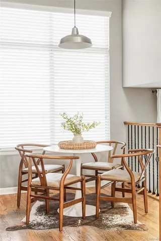 a view of a dining room with furniture and wooden floor