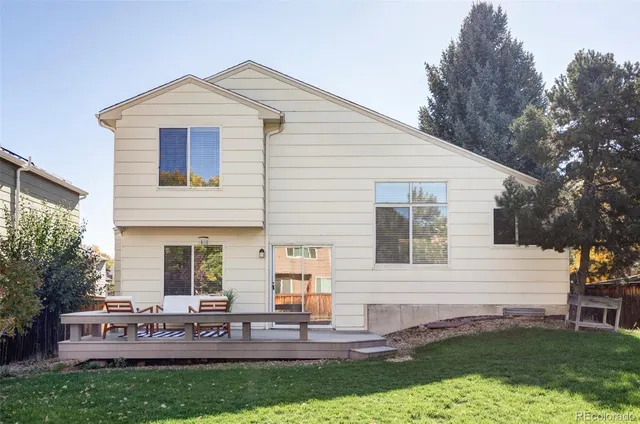 a front view of house with yard and outdoor seating