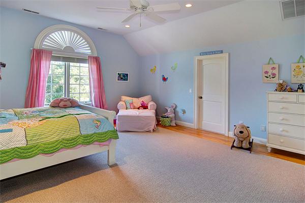 15 Regency Ridge Andover, MA 01810 - Photo 21 of 30 a bedroom with a bed and a chandelier
