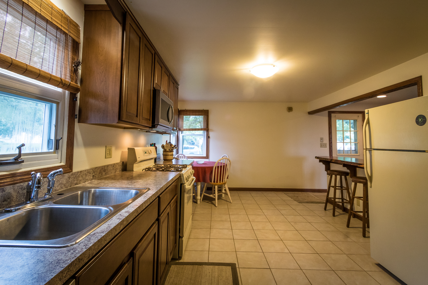 5899 West Clare Road Clare, IL 60111 - Photo 5 of 32 a kitchen with a sink and cabinets