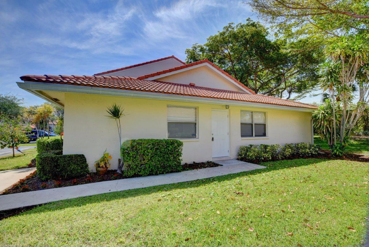 6350 Walk Circle Boca Raton, FL 33433 - Photo 1 of 29 a front view of house with yard and outdoor seating