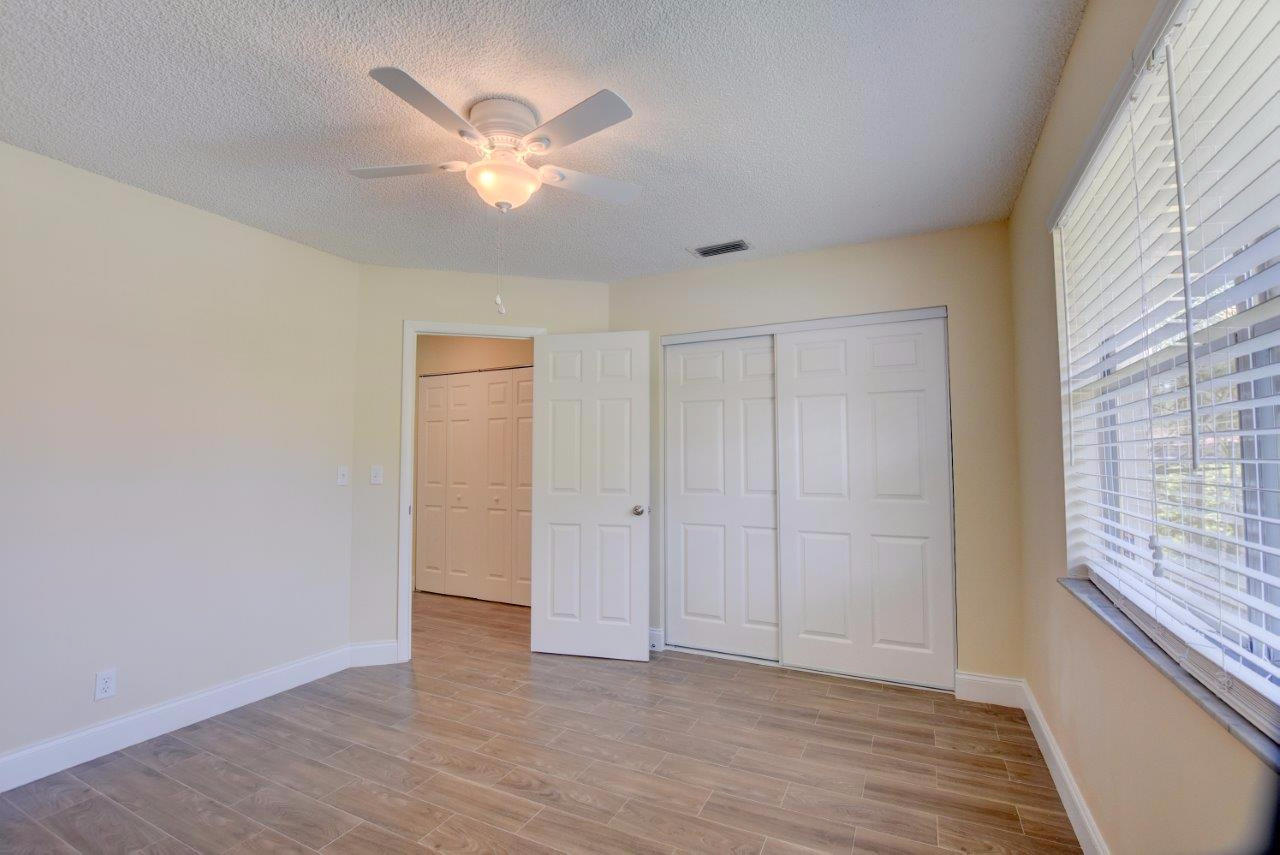 6350 Walk Circle Boca Raton, FL 33433 - Photo 17 of 29 wooden floor in an empty room with a window